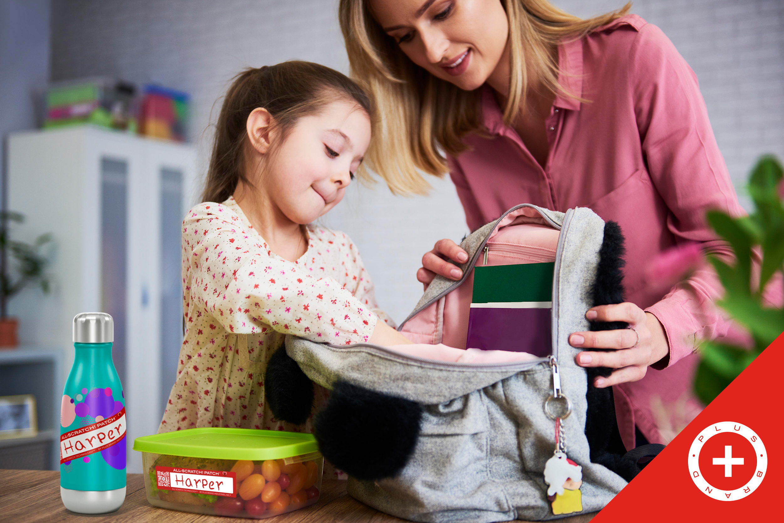 Mom helping daughter pack her lunch and stay safe with the All-Scratch! Patch